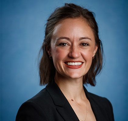 Professional portrait of Ann Bright in dark suit